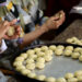 RAMALLAH, Sejumlah wanita Palestina menyiapkan kue-kue tradisional menjelang Hari Raya Idul Fitri di Kota Ramallah, Tepi Barat, pada 28 April 2022. (Xinhua/Ayman Nobani)