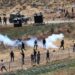 NABLUS, Para pengunjuk rasa Palestina terlibat bentrokan dengan tentara Israel dan personel polisi perbatasan Israel menyusul protes terhadap perluasan permukiman Yahudi di Desa Qaryut, sebelah selatan Kota Nablus, Tepi Barat, pada 24 Juni 2022. (Xinhua/Ayman Nobani)