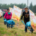YIYANG, Orang-orang berpartisipasi dalam lomba mendorong gerobak di Desa Dongsheng di Mahekou, wilayah Nanxian, Provinsi Hunan, China tengah, pada 21 September 2022. Serangkaian permainan yang berhubungan dengan padi pada Rabu (21/9) diselenggarakan bagi penduduk setempat dan wisatawan untuk menyambut festival panen petani China. (Xinhua/Chen Sihan)