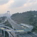 CHONGQING, Foto dari udara yang diabadikan pada 18 Januari 2023 ini menunjukkan ujung utara dari Jembatan Sungai Yangtze Guojiatuo di Chongqing, China barat daya. Dengan panjang total 1.403,8 meter dan bentang utama sepanjang 720 meter, Jembatan Sungai Yangtze Guojiatuo dibuka untuk lalu lintas umum pada Rabu (18/1). (Xinhua/Wang Quanchao)